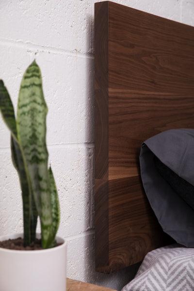 wood headboard detail on platform bed