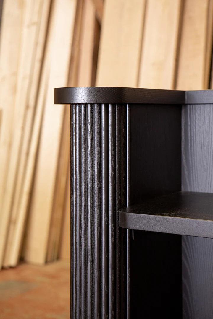 modern reception desk in dark wood